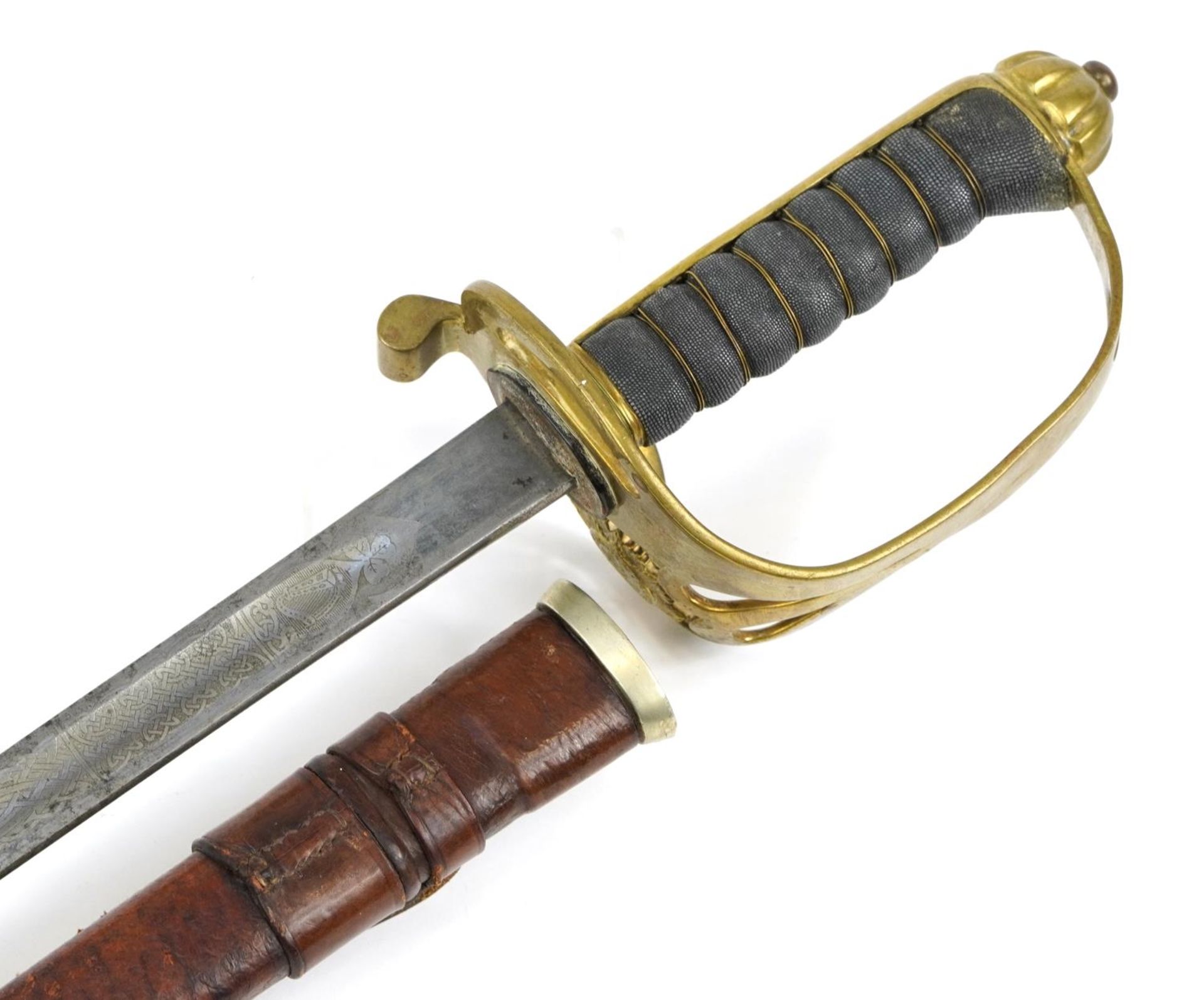 Victorian British military interest dress sword with steel blade engraved with Irish motifs, leather