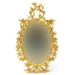 Oval giltwood framed wall hanging mirror with swag design, 92cm x 54cm