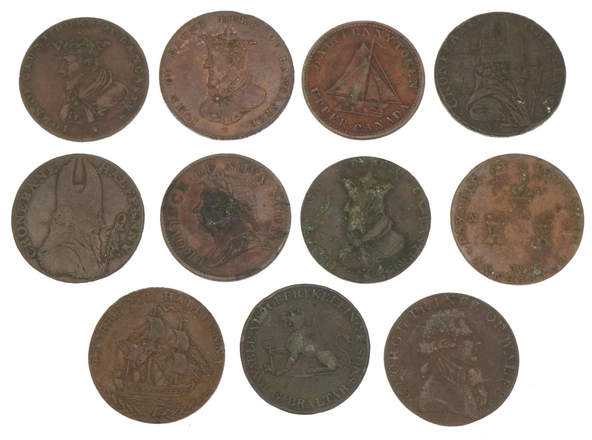 Eleven 18th century half penny tokens including Province of Nova Scotia and value two quartos