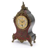 19th century French ebony and boulle work cartouche shape mantle clock with ornate brass mounts, the