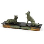 Art Deco black slate and marble centrepiece surmounted with two patinated spelter dogs, 42cm in