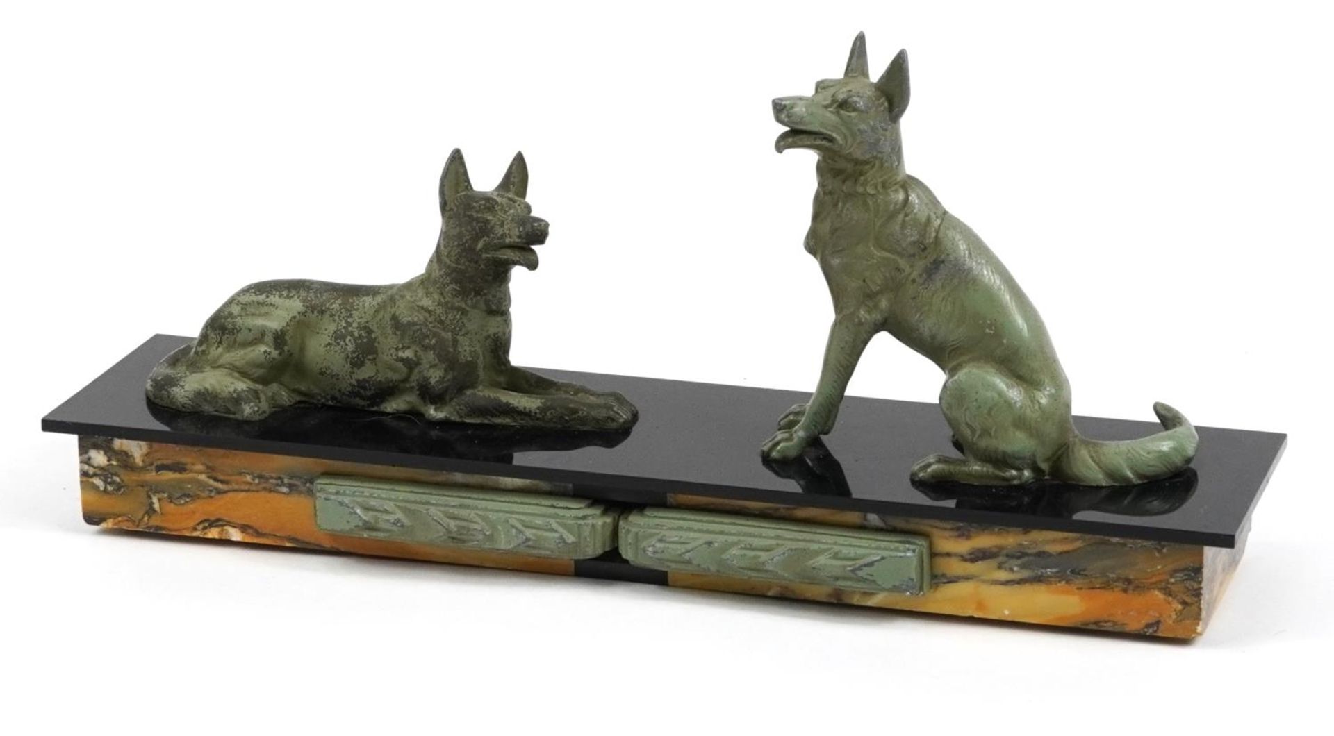 Art Deco black slate and marble centrepiece surmounted with two patinated spelter dogs, 42cm in