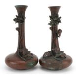 Pair of Japanese bronzed vases decorated in relief with flowers, character marks to the base, each