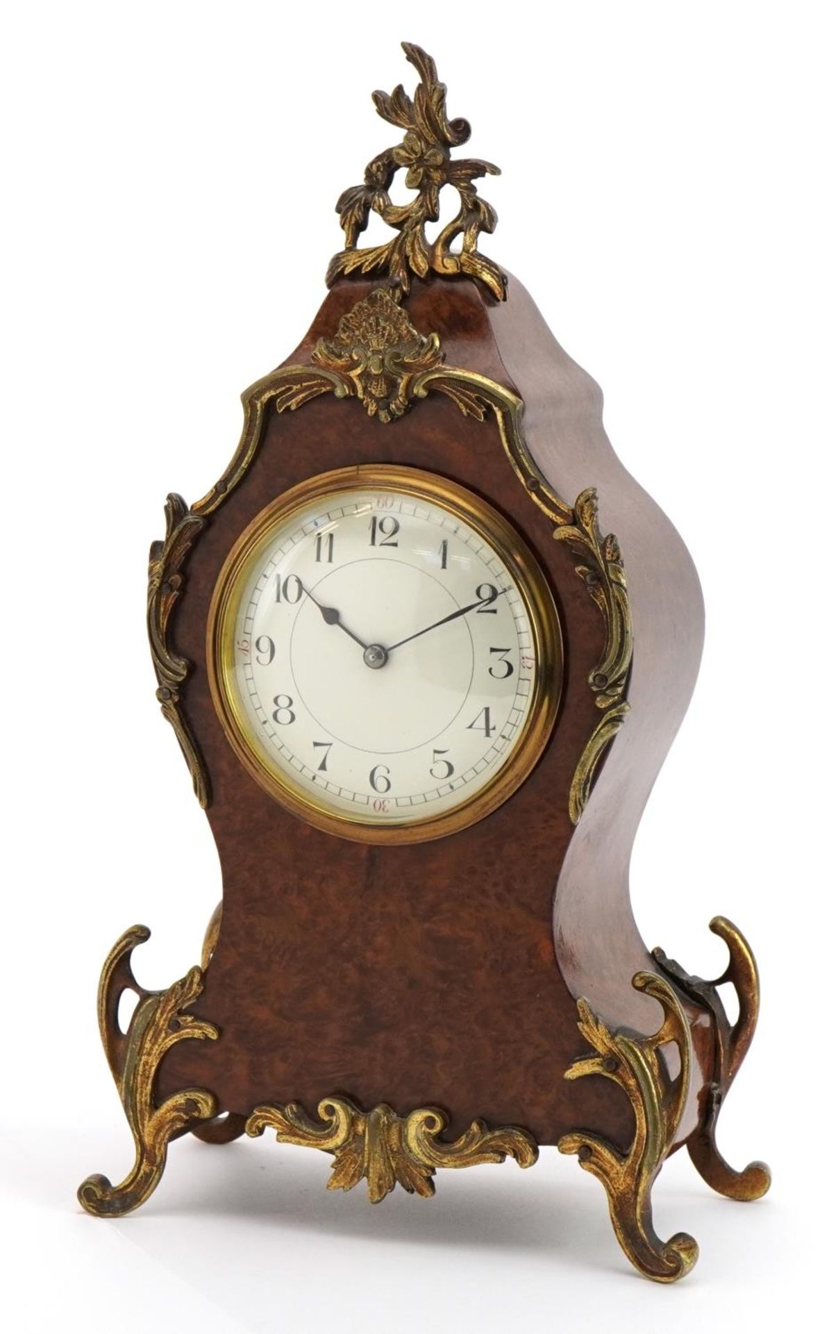 19th century French bird's eye maple cartouche shape mantle clock with ornate brass mounts having