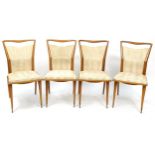 Set of four mid century teak chairs with animal skin upholstered backs and seats, possibly