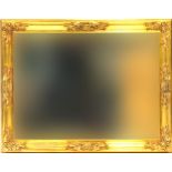 Rectangular ornate gilt framed wall hanging mirror with bevelled glass, 90cm x 70cm