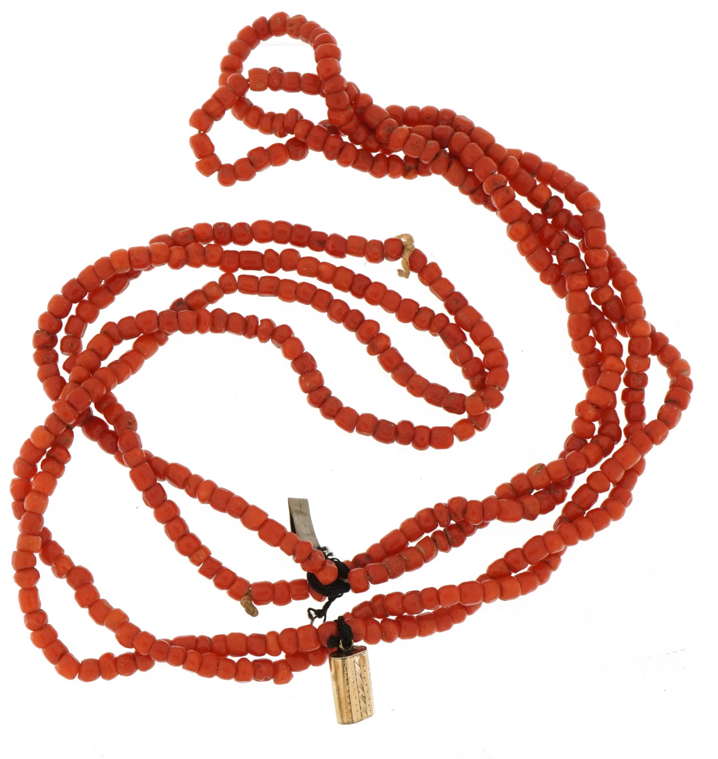 Coral four strand bead necklace with unmarked gold engraved clasp, possibly Victorian, 38cm in - Image 3 of 3