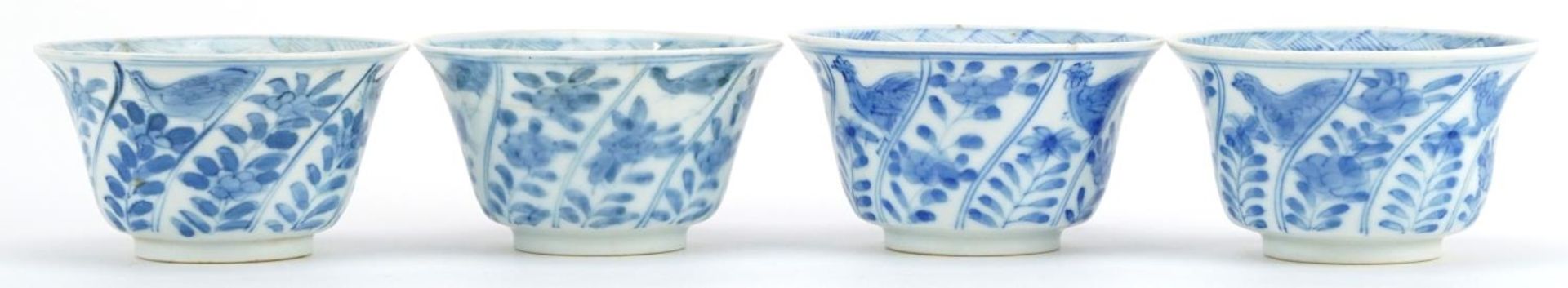 Set of four Chinese blue and white porcelain bowls hand painted with a chicken and flowers, blue