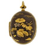 Japanese oval mixed metal locket with gilded relief birds, flowers and junk 3.7cm high, 16.5g