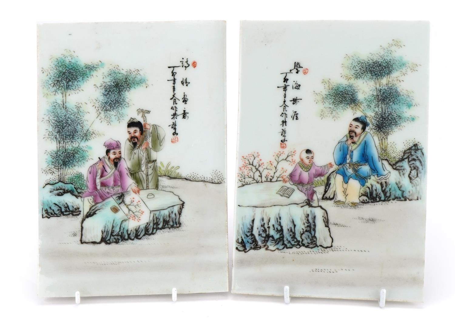 Pair of Chinese porcelain panels hand painted in the famille rose palette including one with a