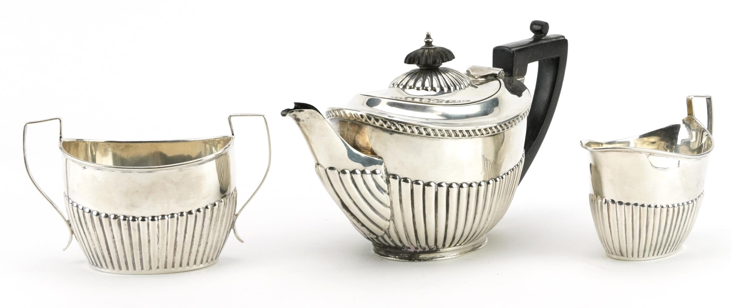 James Deakin & Sons, Victorian silver three piece tea set with demi fluted body, Sheffield 1896, the