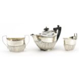 James Deakin & Sons, Victorian silver three piece tea set with demi fluted body, Sheffield 1896, the