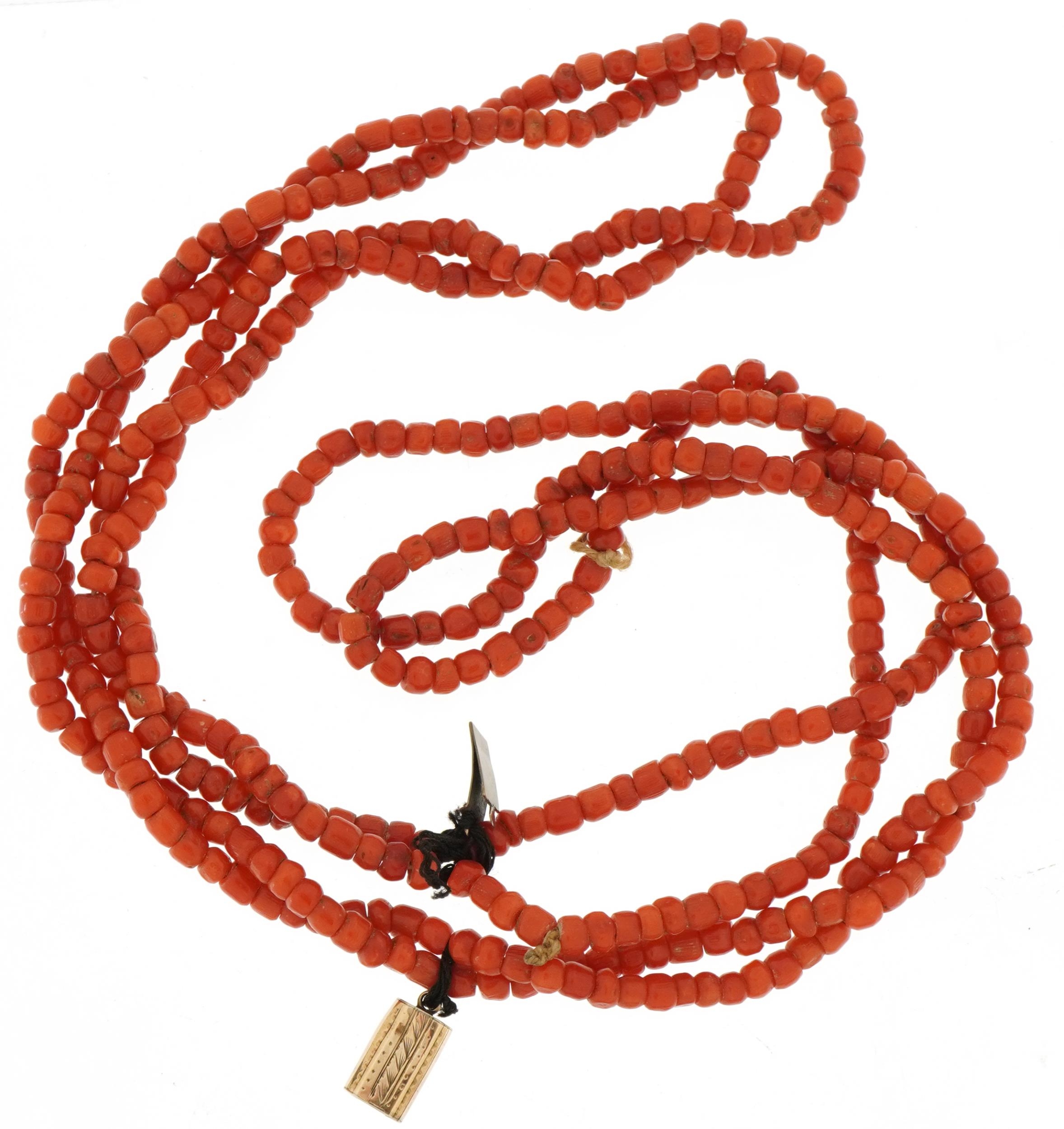 Coral four strand bead necklace with unmarked gold engraved clasp, possibly Victorian, 38cm in - Image 2 of 3