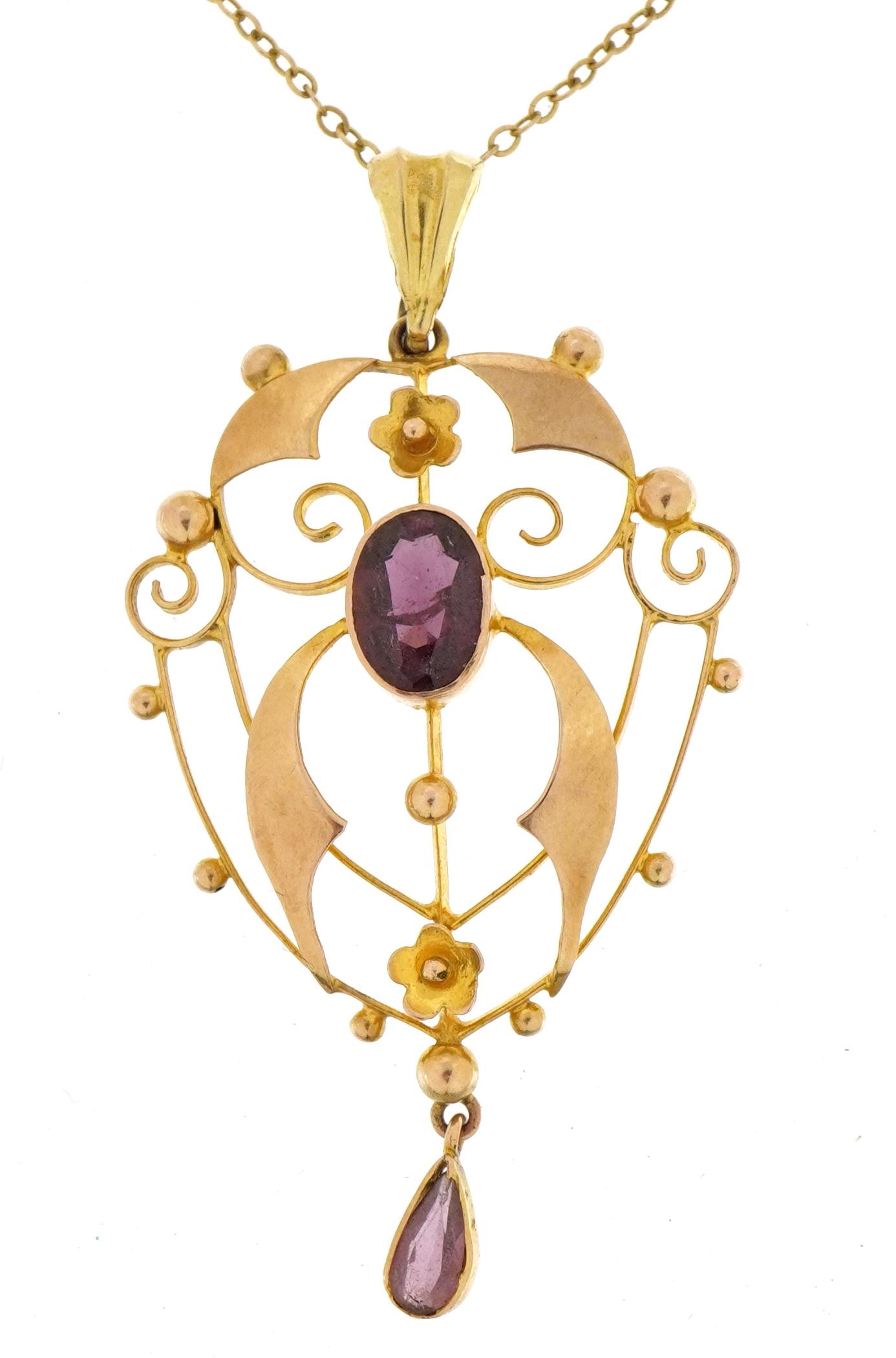 Edwardian 9ct gold openwork pendant set with two amethysts on a 9ct gold Belcher link necklace, 5.