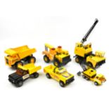 Six vintage tinplate construction vehicles including Tonka, the largest 65cm high