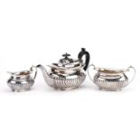 Victorian silver three piece tea service, the teapot with wooden handle and knop, G H maker's mark