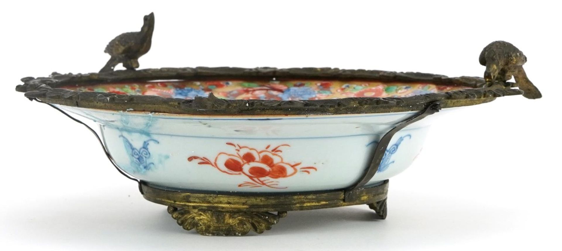 Chinese porcelain soup bowl with gilt metal mounts hand painted with flowers, 25cm in diameter - Image 3 of 3