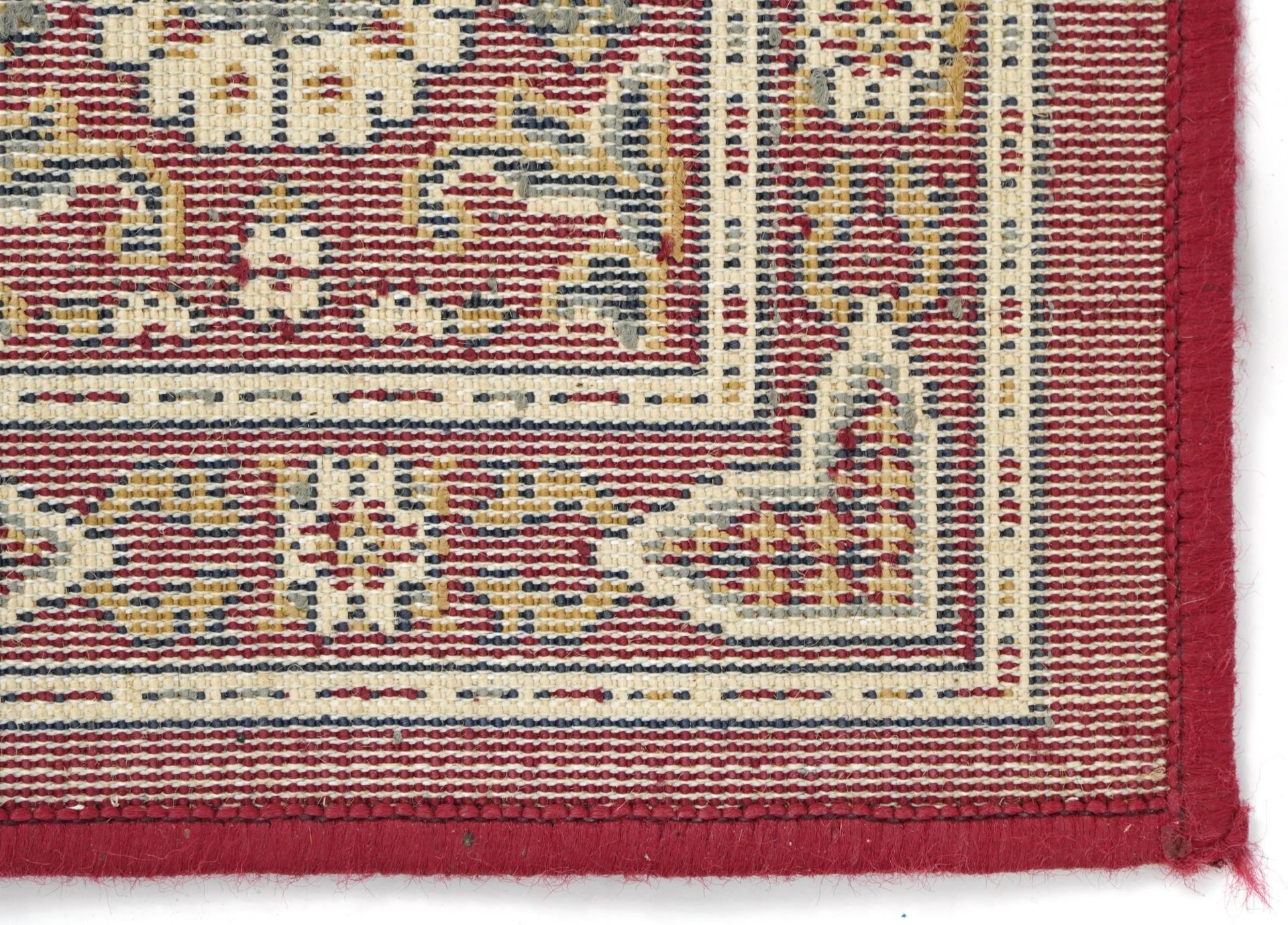 Rectangular Persian rug, the central field having a repeat tree design, the red ground borders - Bild 6 aus 7
