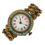 Vintage brass ladies wristwatch with turquoise set case, enamel dial and concertina strap, 32mm in
