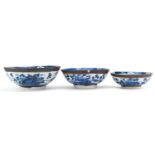 Graduated set of three Chinese crackle glazed bowls hand painted with flowers and landscapes, the