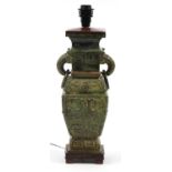 Chinese archaic style patinated metal vase design table lamp with hardwood mounts, 39.5cm high