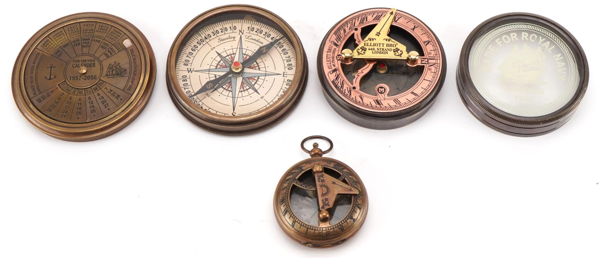 Three nautical interest brass compasses, the largest 7.5cm in diameter