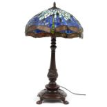 Bronzed metal Tiffany design table lamp with leaded glass dragonfly shade, 68cm high