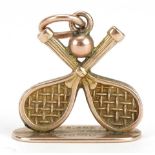 9ct gold tennis racquet and ball charm, 1.7cm wide, 1.8g