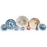 Chinese and Japanese ceramics including a pair of blue and white dishes hand painted with flowers