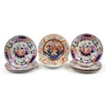 Pair of early 19th century Derby Imari porcelain soup bowls and seven ironstone plates, the