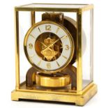 Jaeger LeCoultre brass cased Atmos clock, the circular chapter ring having Arabic numerals, serial