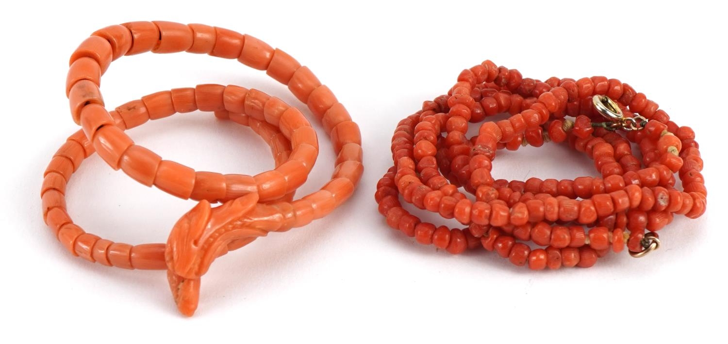 Good Chinese carved coral phoenix coil bracelet and a single strand bead necklace, total 37.1g