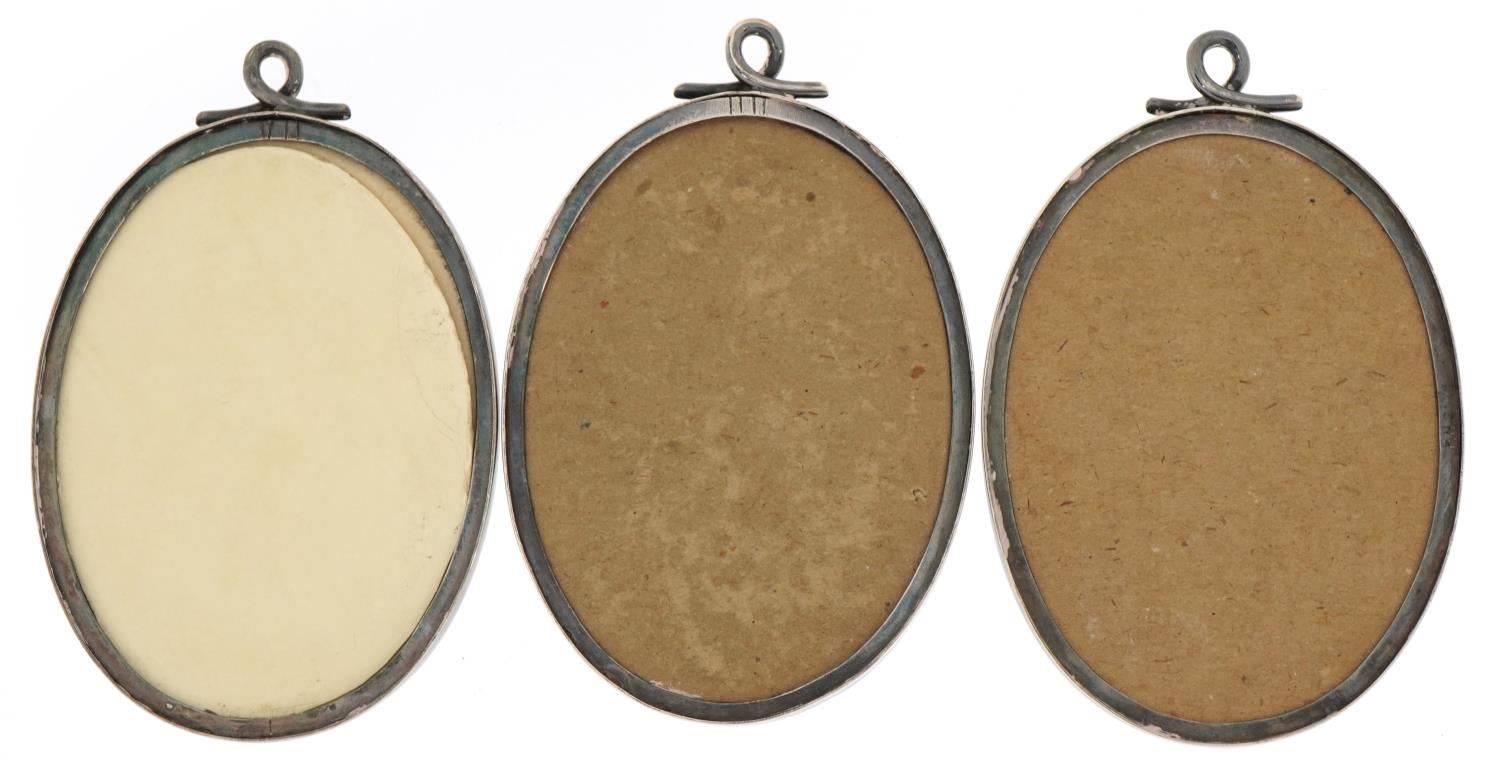 James Dixon & Sons Ltd, set of three Edwardian oval silver photo frames, each housing a - Image 3 of 3