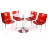 Calligaris, Italian circular chrome and glass dining table with four red Lucite chairs, the table