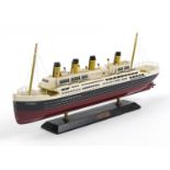 Hand painted wooden model of the Titanic, 50cm in length