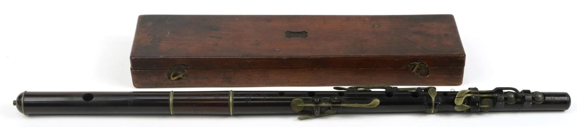 Boosey & Sons, Victorian rosewood four piece flute housed in a velvet lined mahogany case with R S