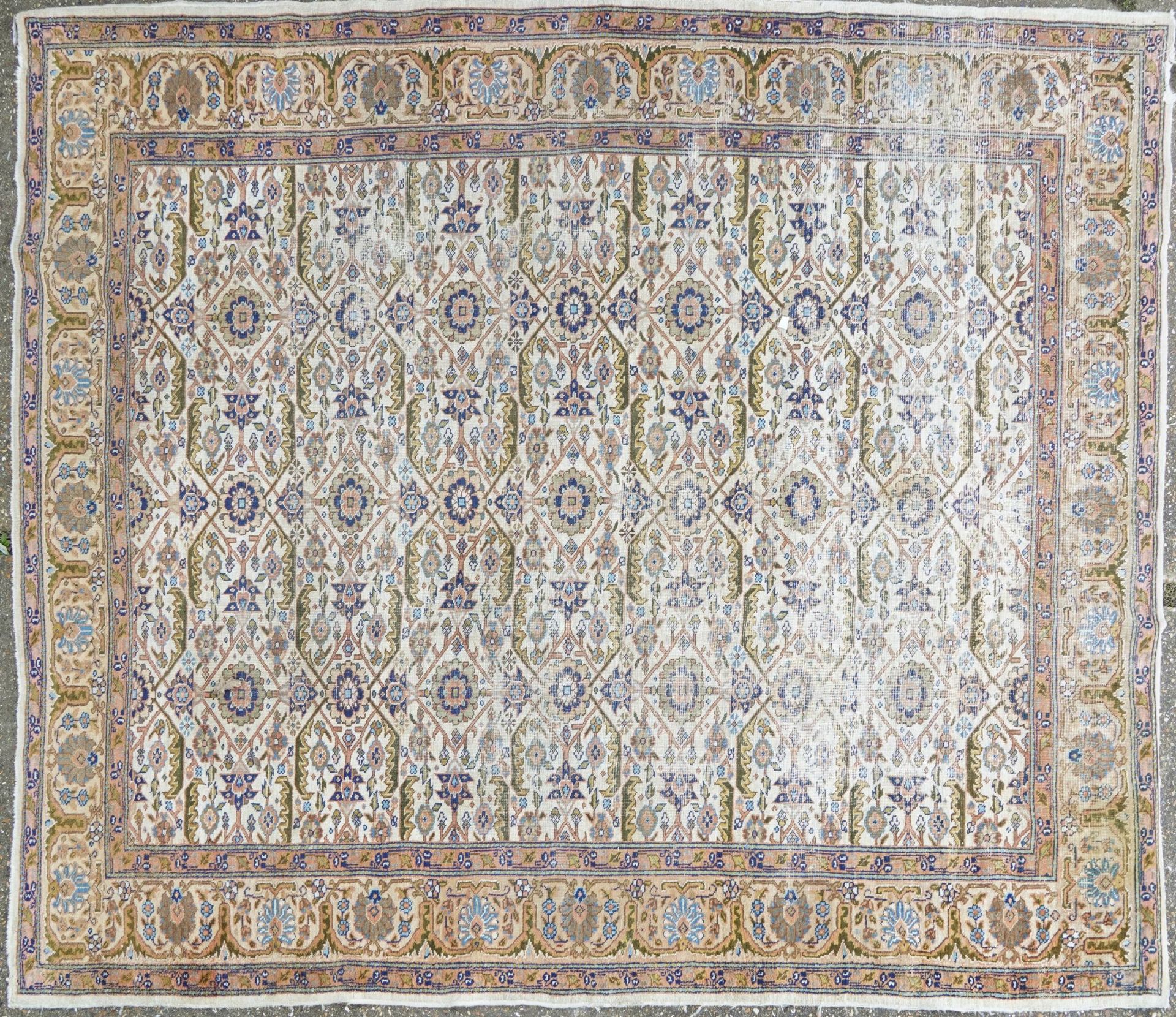 Rectangular Persian rug having an allover floral design within corresponding borders, 345cm x 255cm