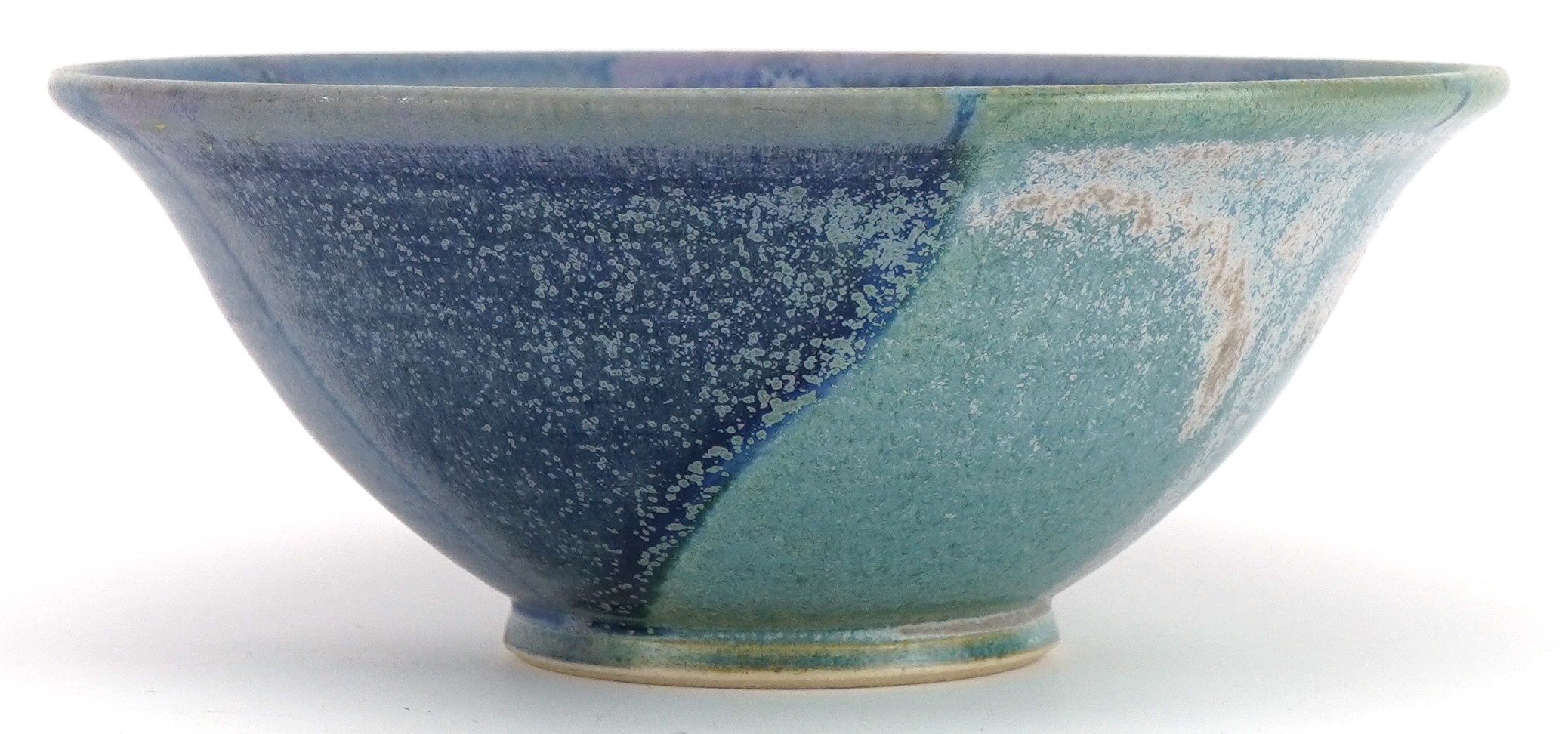 Studio pottery bowl having a blue dripping glaze, impressed marks to the base, 14cm in diameter