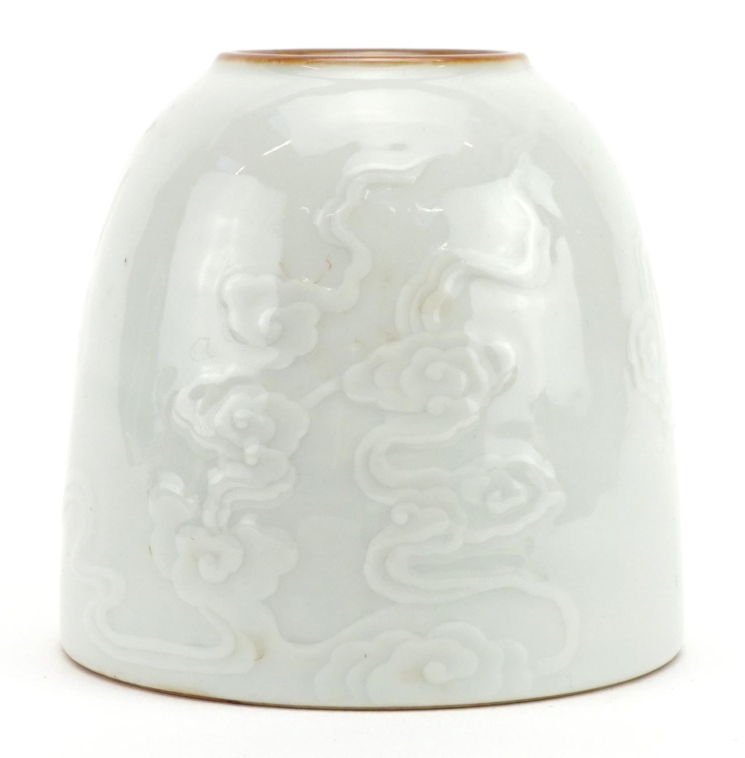 Chinese porcelain brush washer having a blanc de chine glaze, decorated in low relief with clouds, - Image 2 of 3