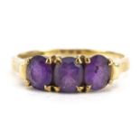 9ct gold amethyst three stone ring, the largest amethyst approximately 5.2mm x 3.8mm, size L, 1.8g