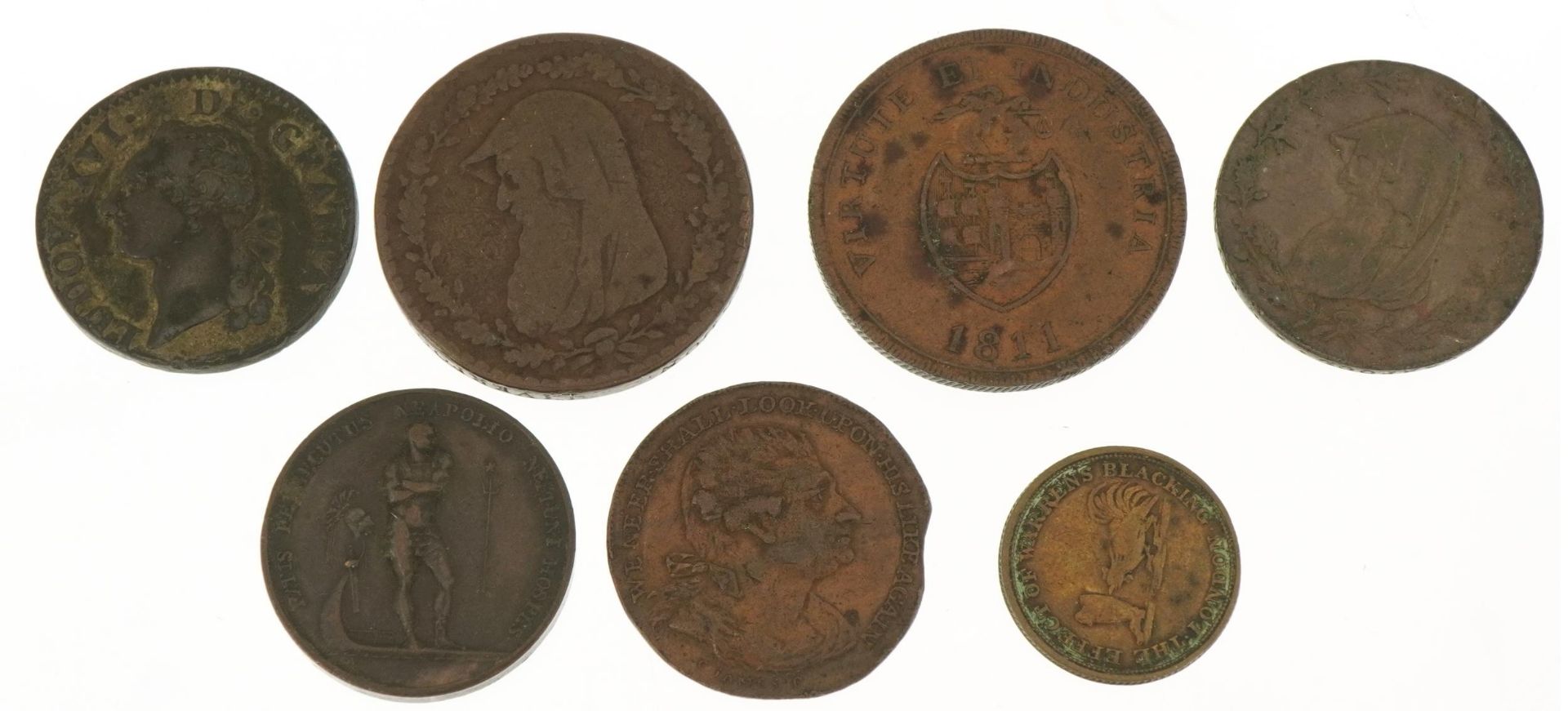 Seven 18th century and later coins and tokens including Anglesey Mines halfpenny
