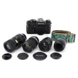 Nikkormat EL camera with four lenses comprising Tamron 90mm, Tokina 17mm, Nikkor 55mm and Kikkor