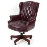 Mahogany framed captain's chair with burgundy leather button upholstery, 109cm high