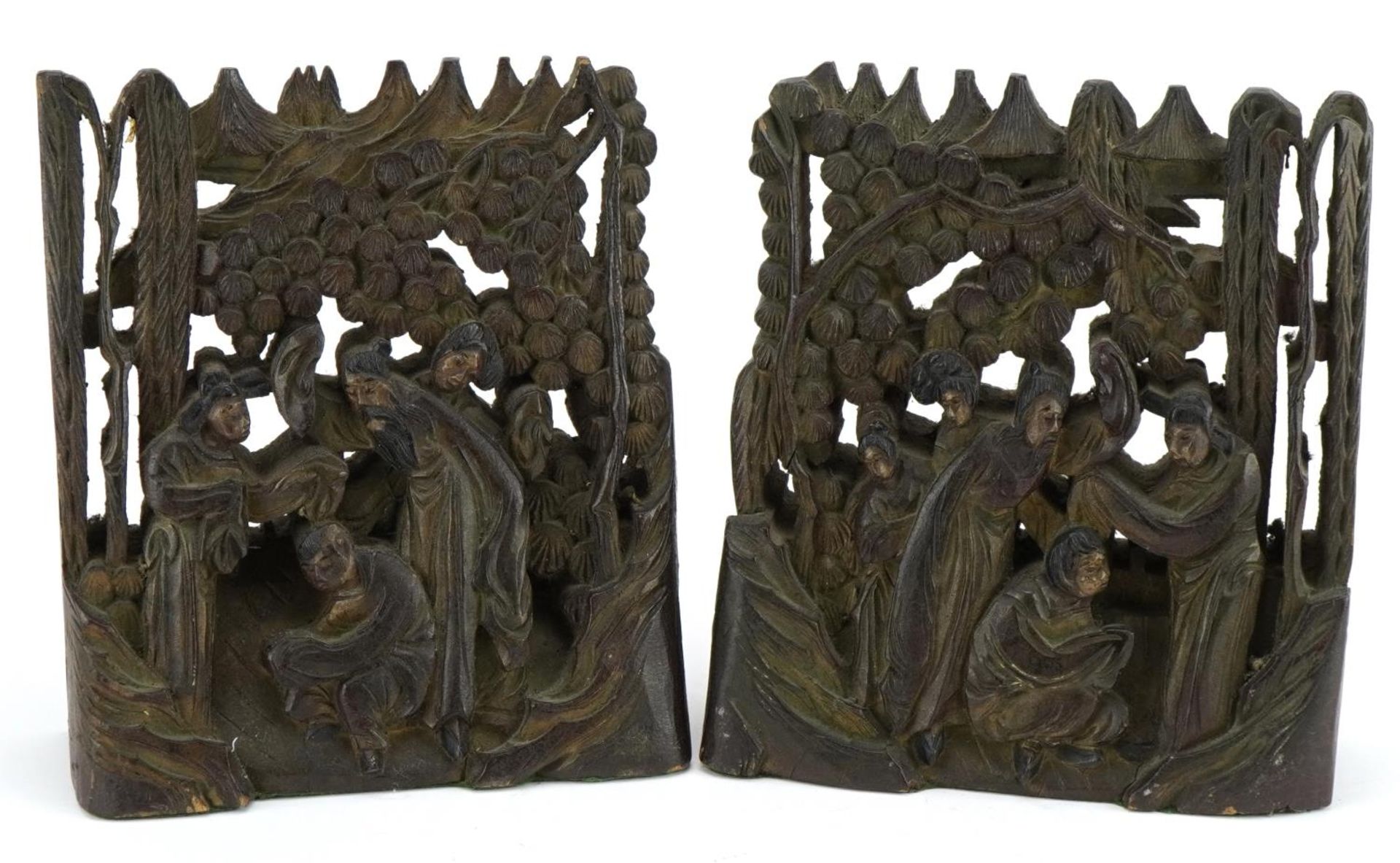 Pair of Chinese hardwood bookends carved with figures beneath cherry blossom