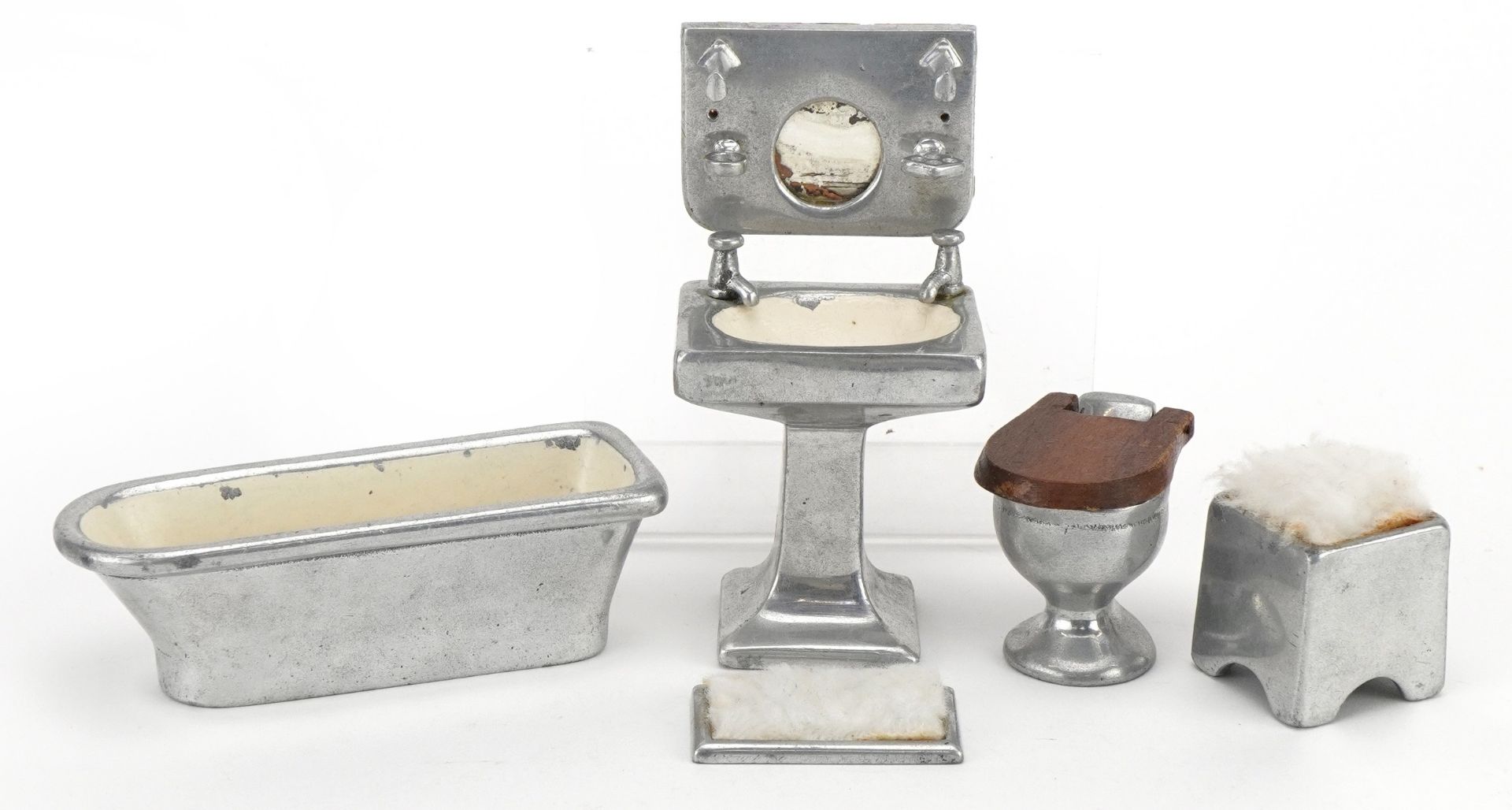 Early 20th century aluminium doll's house furniture including toilet set, the largest 11cm in length