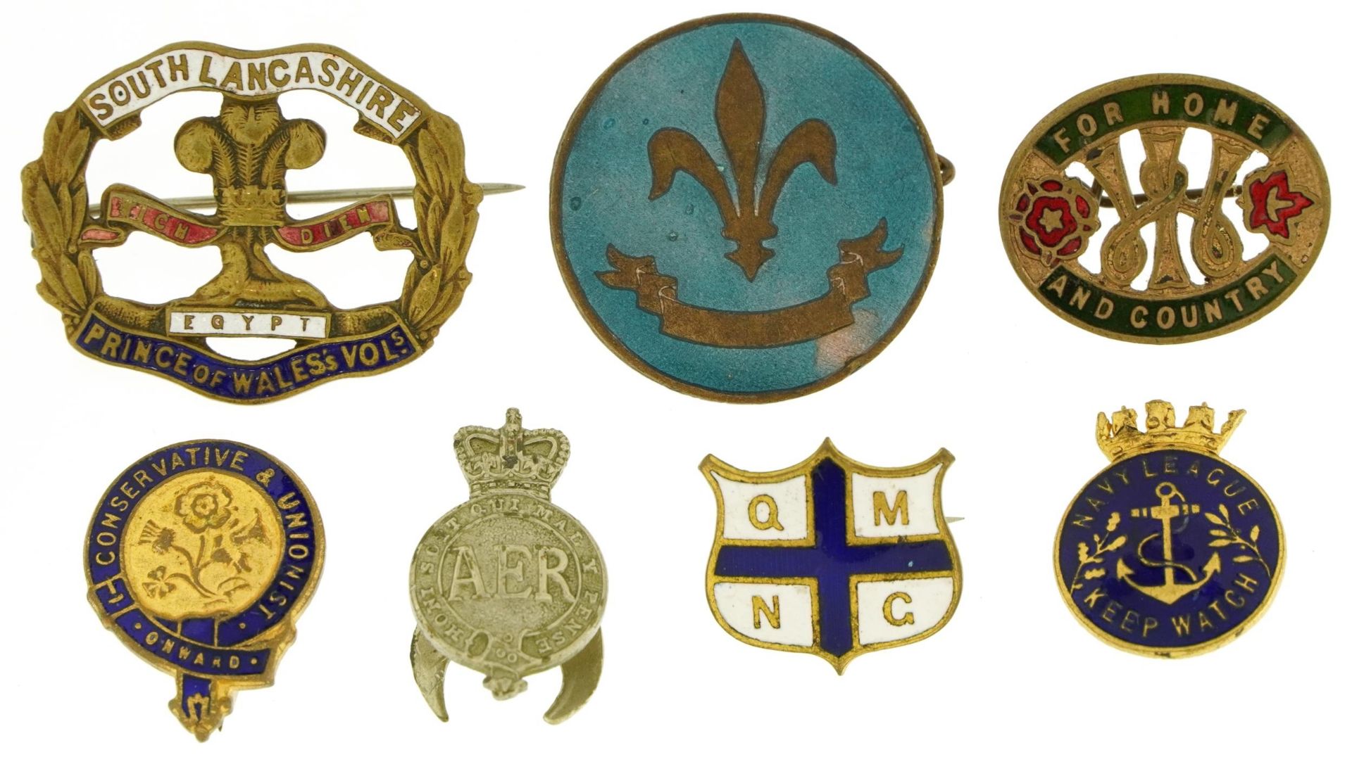 Seven vintage badges, some enamelled including boy scouts, Navy League and AER, the largest 3.5cm