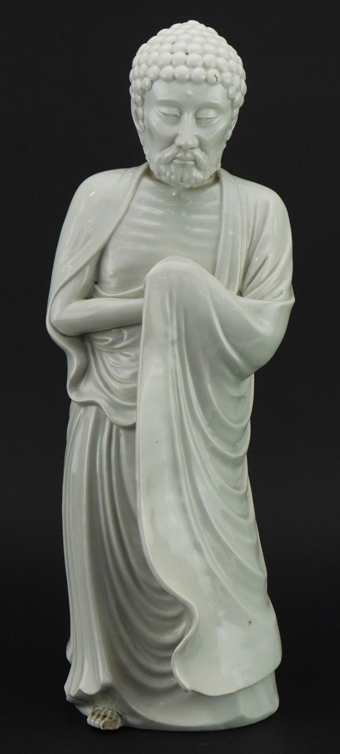 Large Chinese porcelain figure of a Buddhist god having a blanc de chine glaze, 43.5cm high