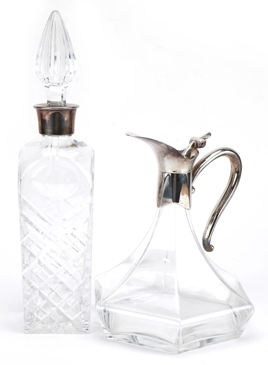 Cut glass decanter etched whisky and a claret jug both with silver plated mounts, the largest 34cm
