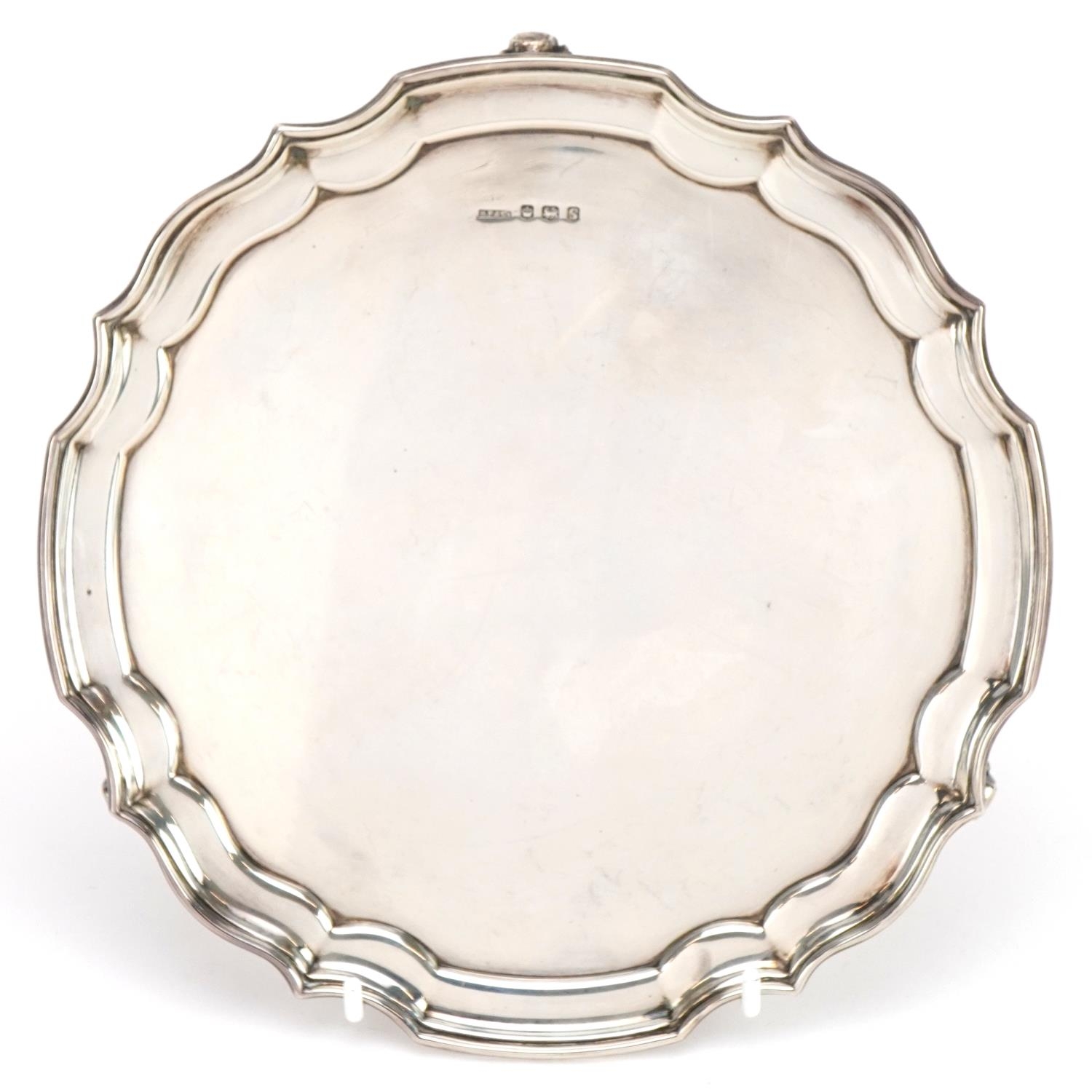 Harrison Fisher & Co, Elizabeth II circular silver salver raised on three scrolled feet, Sheffield - Image 2 of 5