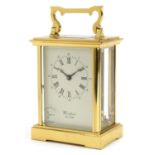 Woodford, brass cased eight day carriage clock with bevelled glass panels, the dial having Roman